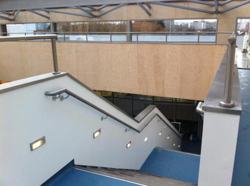 Academy installed stainless steel stair handrails and folded sheet capping